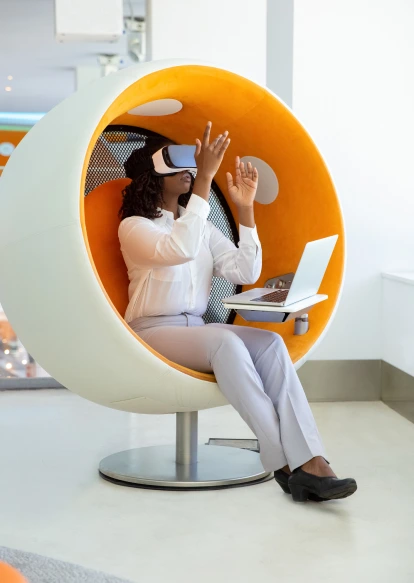  about-two:A young woman wearing a virtual reality (VR) headset, immersed in a virtual environment, with a look of wonder and fascination on her face